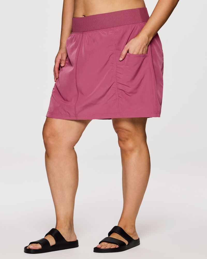 Front of a model wearing a size 1X Plus All In Ruched Skort in Berry by RBX Active. | dia_product_style_image_id:352934